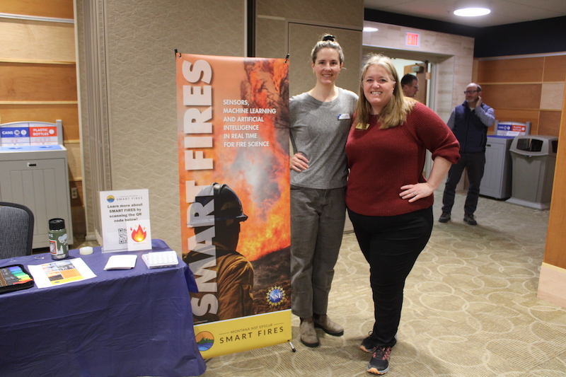 Staff from SMRC pose in front of the SMART FIRES table