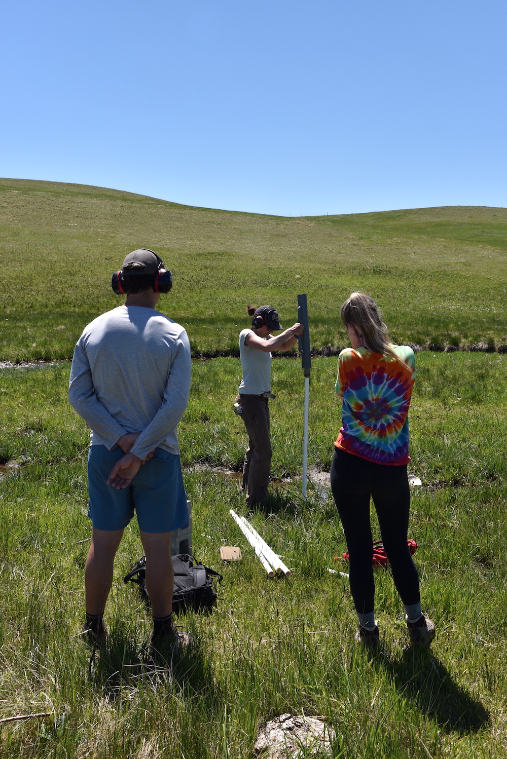 Caitlin Mitchell demonstrates how to install a groundwater sampling well