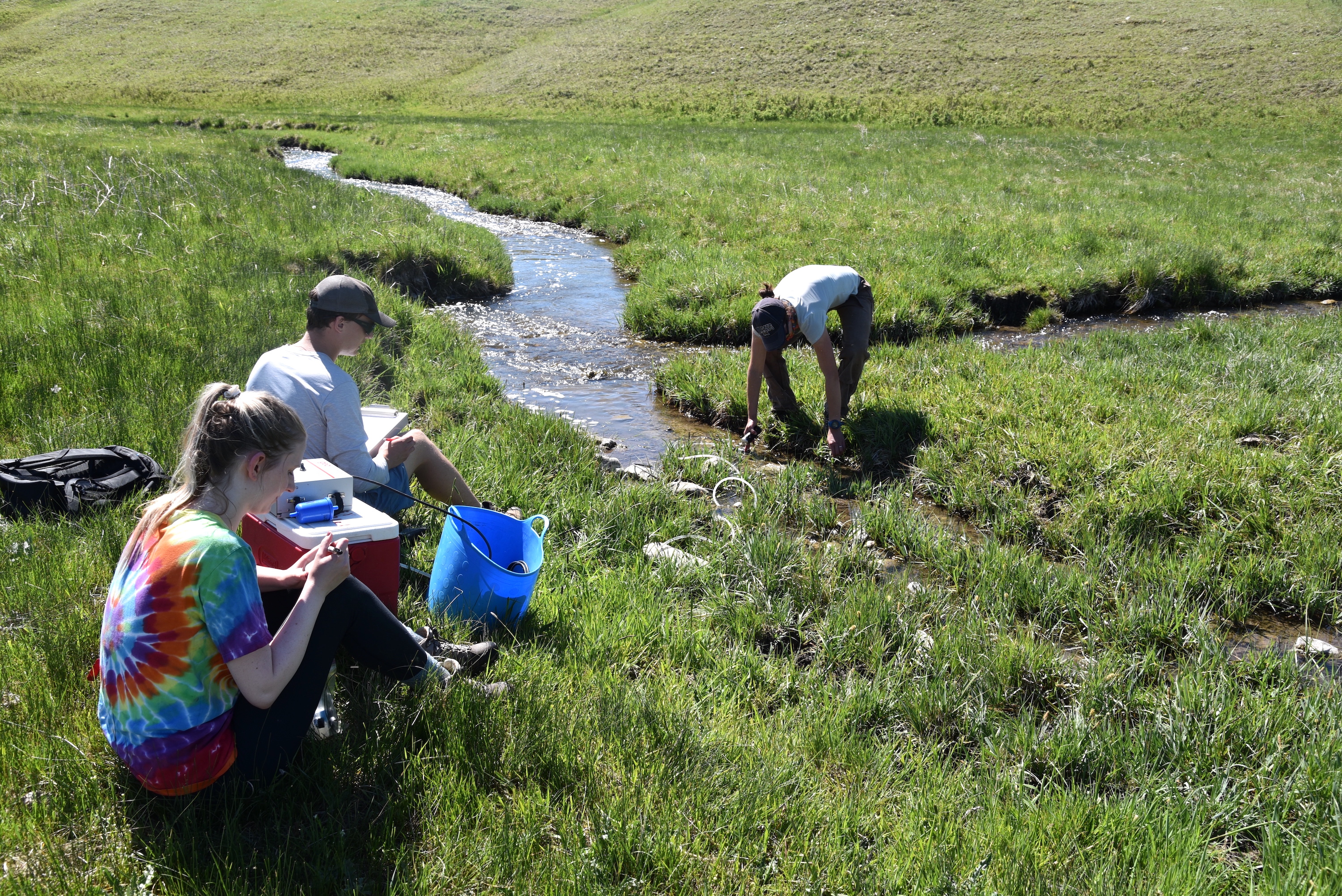 Caitlin Mitchell adjusts surface water sampling equipment