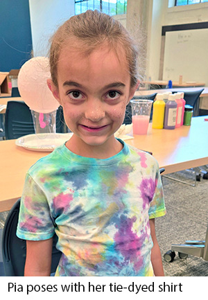 Pia poses with her tie-dyed shirt