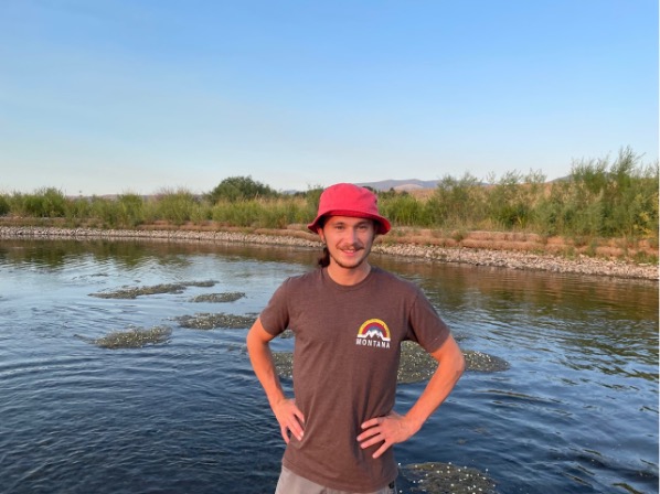 Man standing in river in Montana