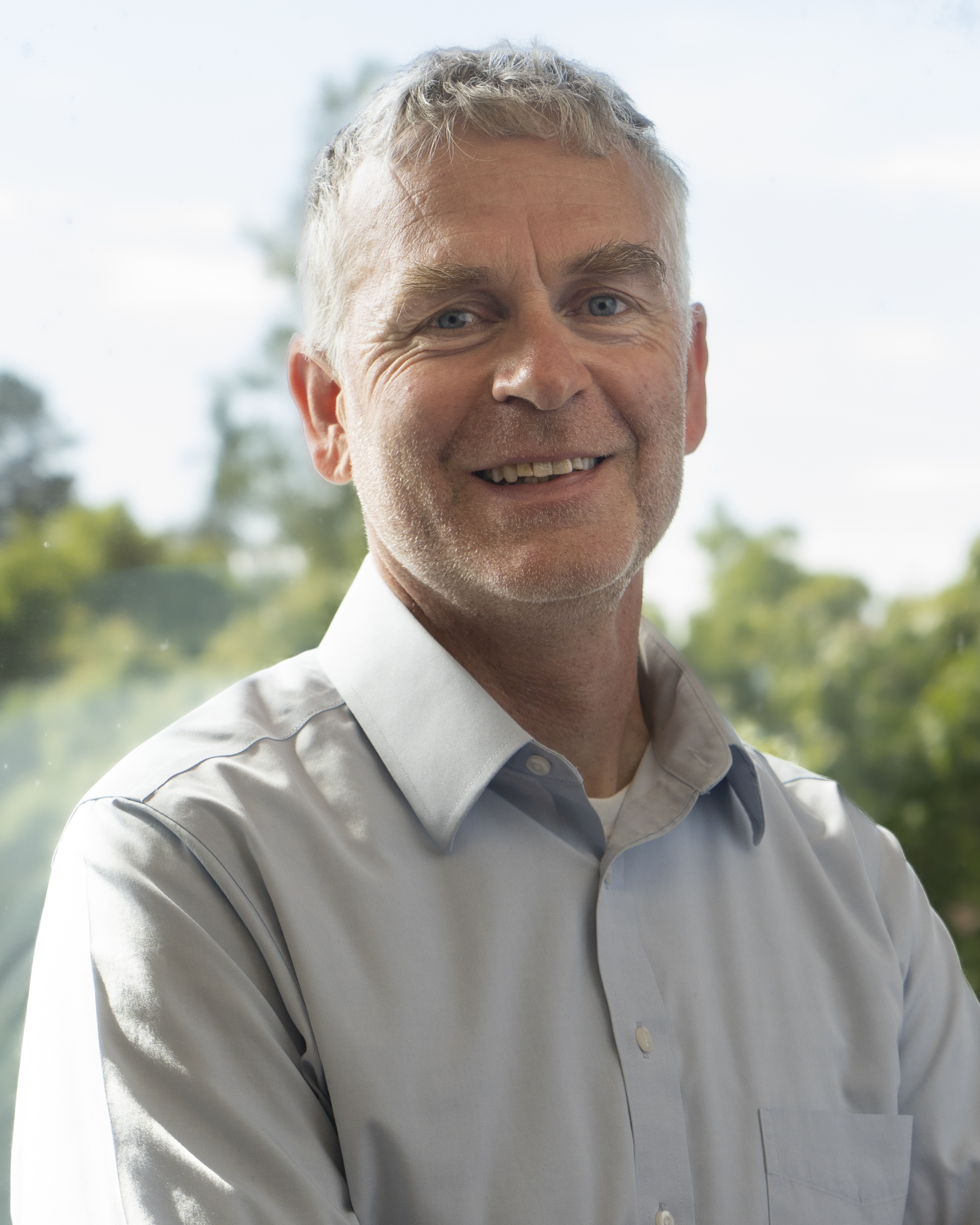 Valentijn Hoff poses with a background of foliage