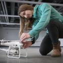 Shannon Hamp with a drone in Norm Asbjornson Hall on April 13, 2023. MSU Photo by Colter Peterson