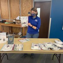 Suzi Taylor holds a citizen science kit at the giveaway