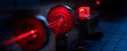 A laser beam shines through optical components in a Gallatin College photonics lab Monday, Feb. 7, 2022, in a Montana State University lab in Bozeman, Mont. MSU photo by Kelly Gorham