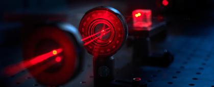 A laser beam shines through optical components in a Gallatin College photonics lab Monday, Feb. 7, 2022, in a Montana State University lab in Bozeman, Mont. MSU photo by Kelly Gorham
