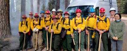 Prescribed Fire Team stands in front of the mobile smoke laboratory van