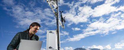 Joseph Knudsen looking at the High-Quality Atmospheric Readings and Telemetry Station 