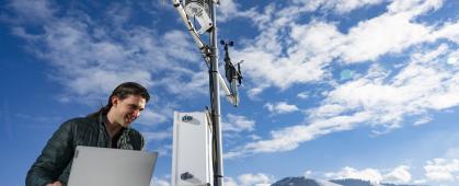 Joseph Knudsen looking at the High-Quality Atmospheric Readings and Telemetry Station