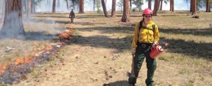 Maggie Epstein working on a prescribed fire