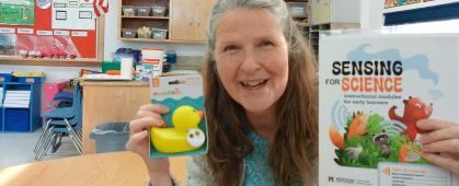 A teacher unboxes her school's kit