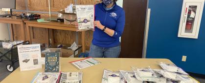 Suzi Taylor holds a citizen science kit at the giveaway
